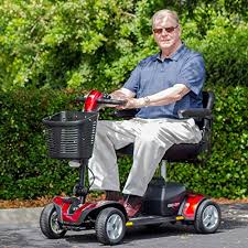 Older gentleman rides on red and black scooter. Offers Independence versus being housebound.