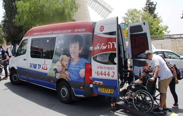 Van with Yad Sarah Graphics Providing Transport to those in Wheelchairs