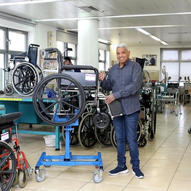 Volunteer Refurbishing Yad Sarah Wheelchair